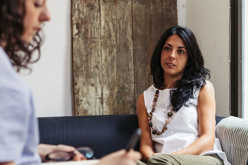 Psychotherapy session, woman talking to her psychologist in the studio