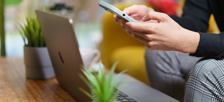 A person installing ad blockers on their phone to avoid the the psychological impact of gambling ads