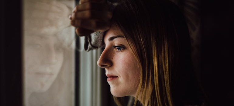 Person feeling overwhelmed while questioning if their behavior is addiction or compulsive behavior