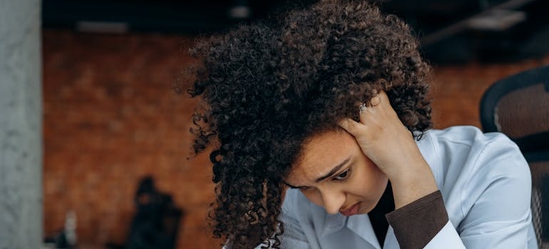 A person feeling anxious due to the psychological impact of gambling ads