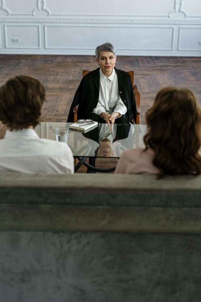 a therapist talking with a man and a women during anxiety therapy in Massachusetts