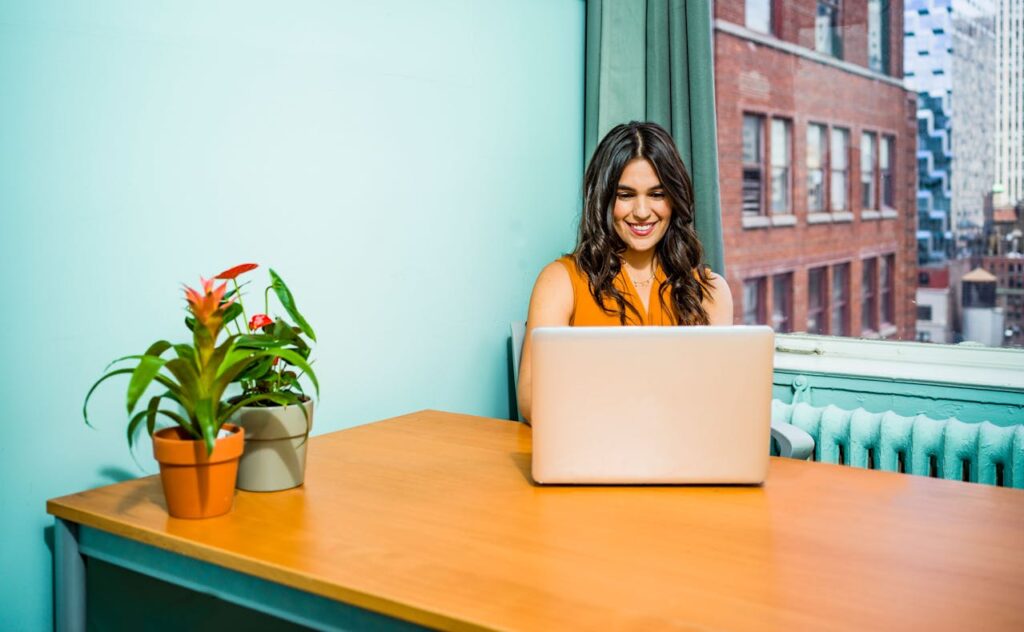 a women using a laptop to access online therapy for gambling addiction​