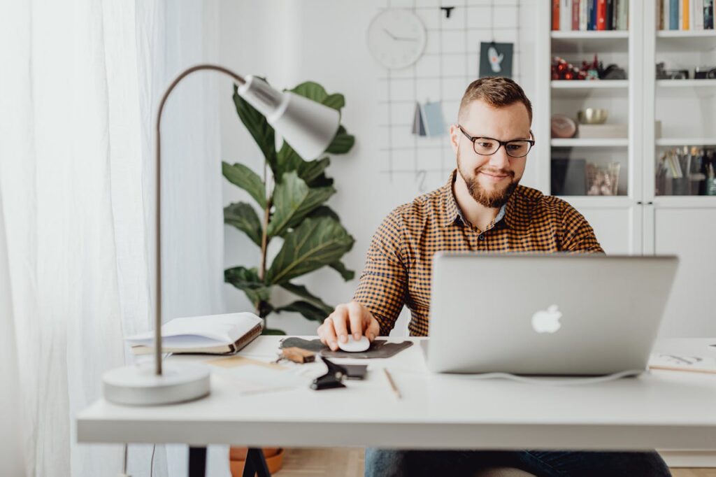 a man using a computer to access an adjustment disorder therapy massachusetts program