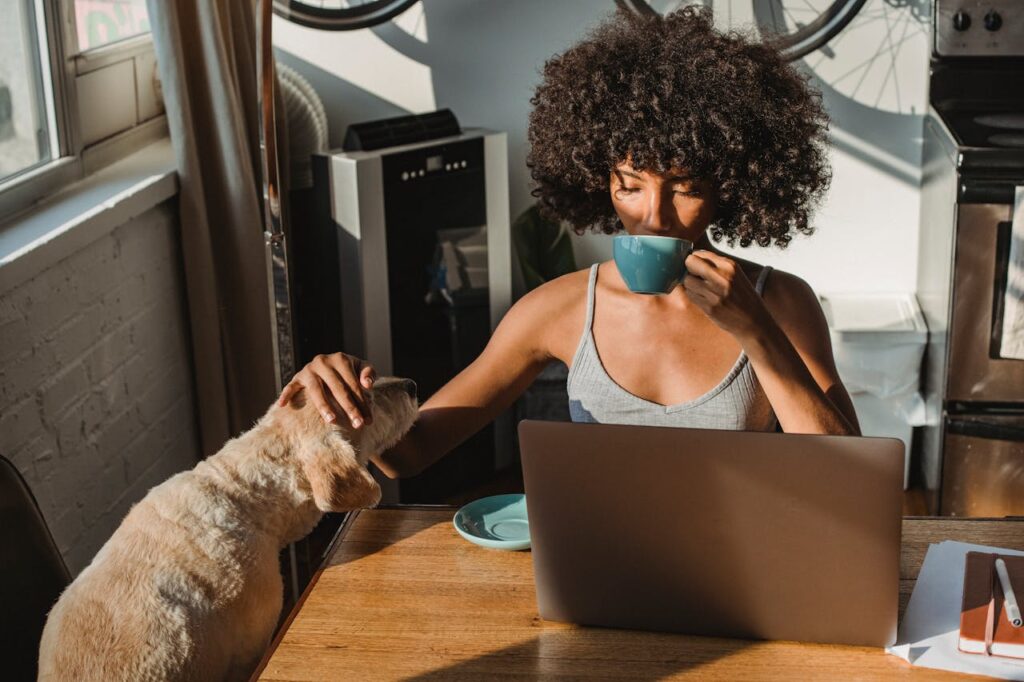 a women drinking tea, petting her dog and participating in borderline personality disorder treatment massachusetts program
