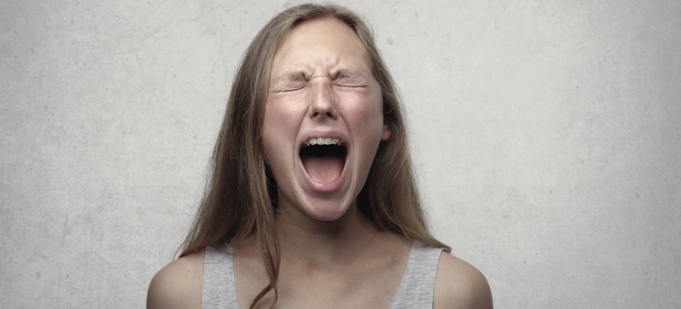 an angry girl shouting 