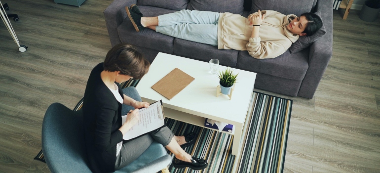 Person laying on the couch during a therapy session