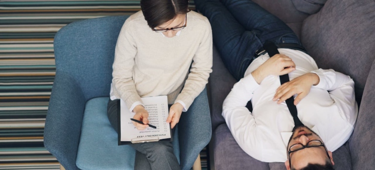 a man talking to a female therapist 