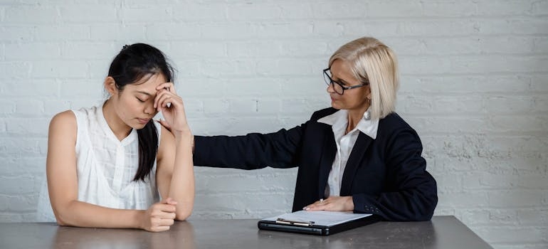 a therapist comforting a woman 