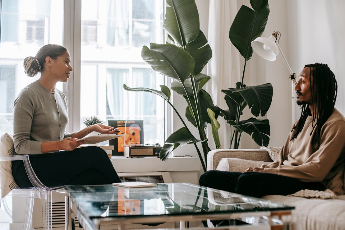 a man talking with a therapist about setbacks in recovery