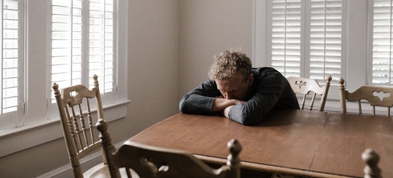 A depressed person sitting alone