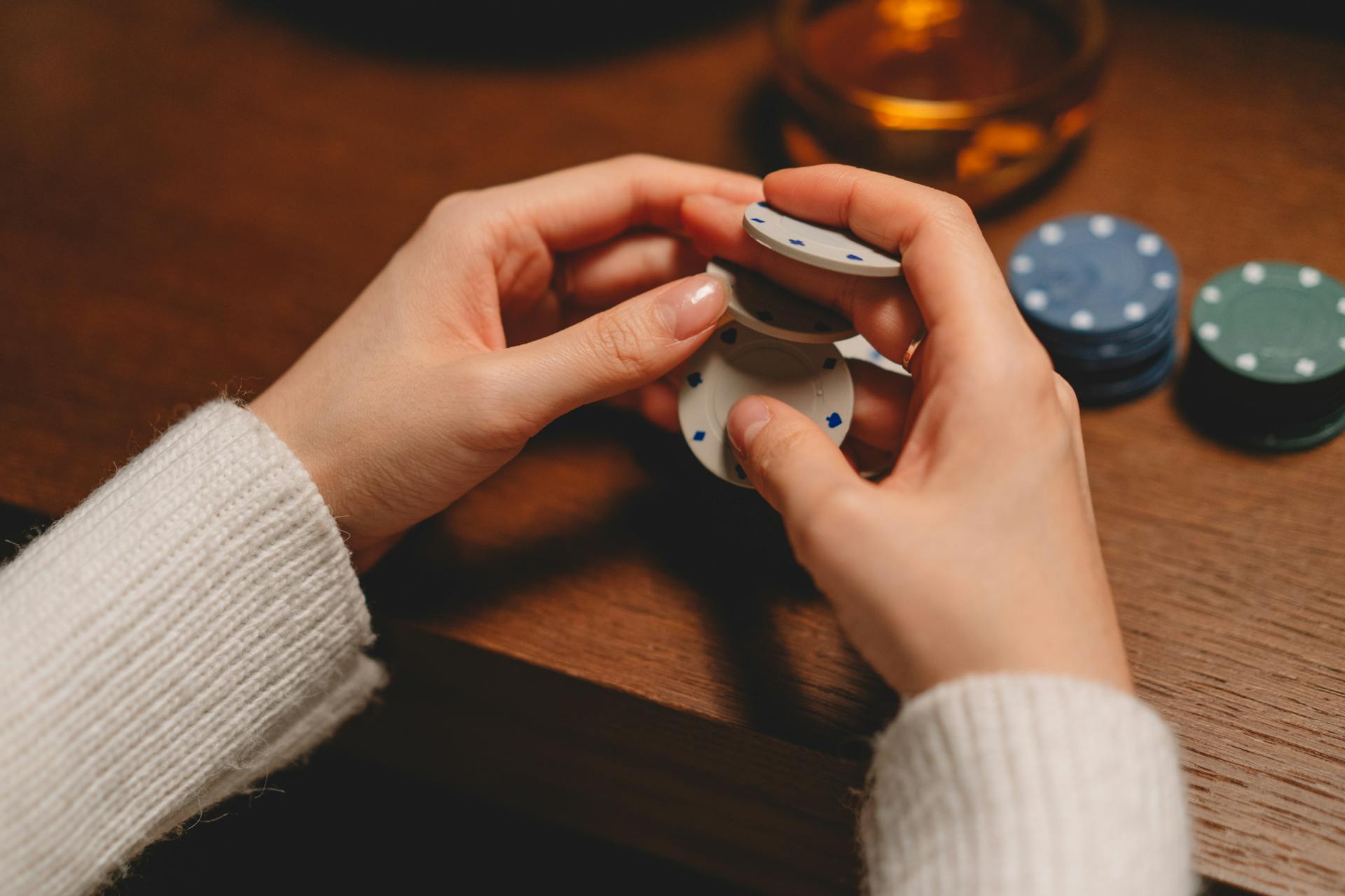 A person holding poker chips