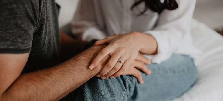 a couple holding hands 