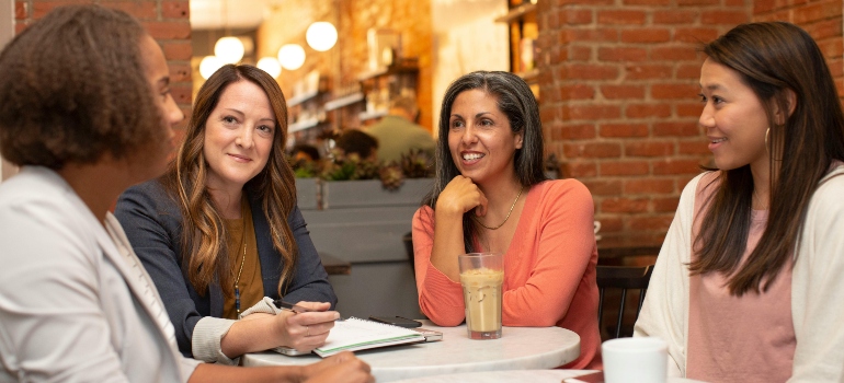 People in a casual social setting enjoying the Feel Free drink.