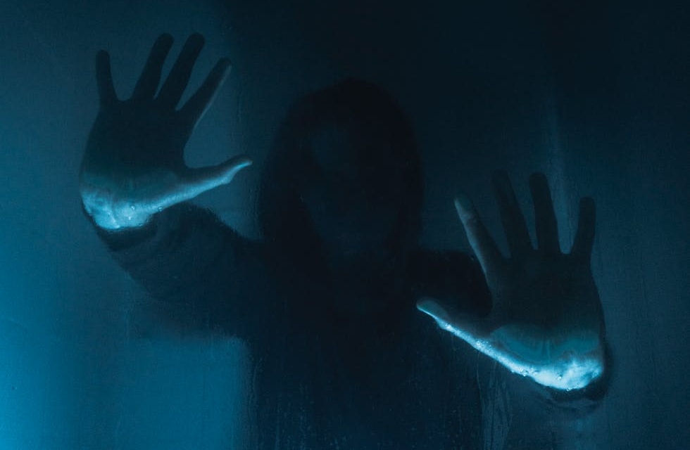 Woman Silhouette in Darkness